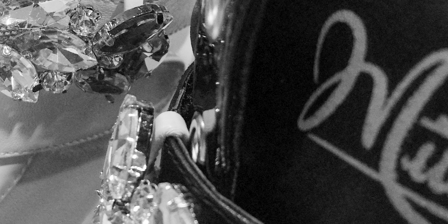 Crystal trim beside the Mitchell signature on a boot